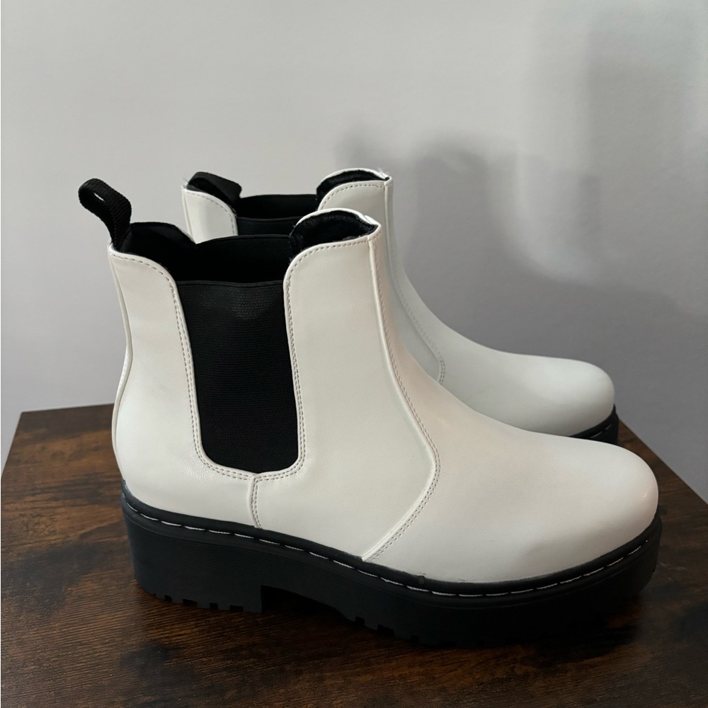 Black and white chunky Chelsea style boots.